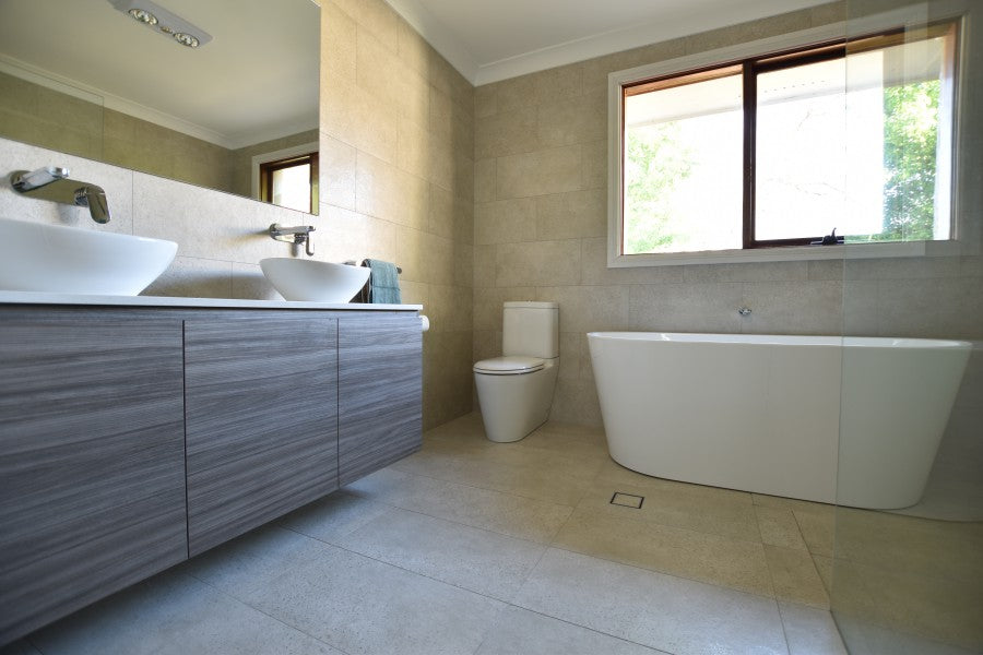 #44 - Bathrooms: Greige concrete look tiles throughout these rooms by Jason