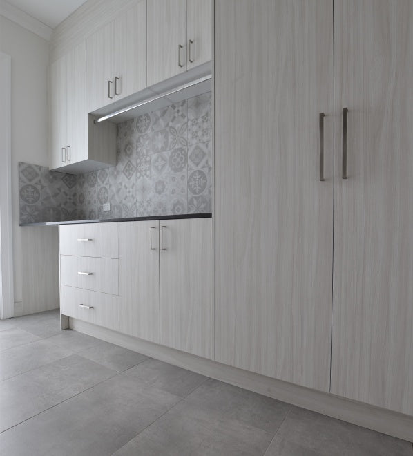 #78 - Laundries: Encaustic look tiles adorn a laundry splashback by Trio