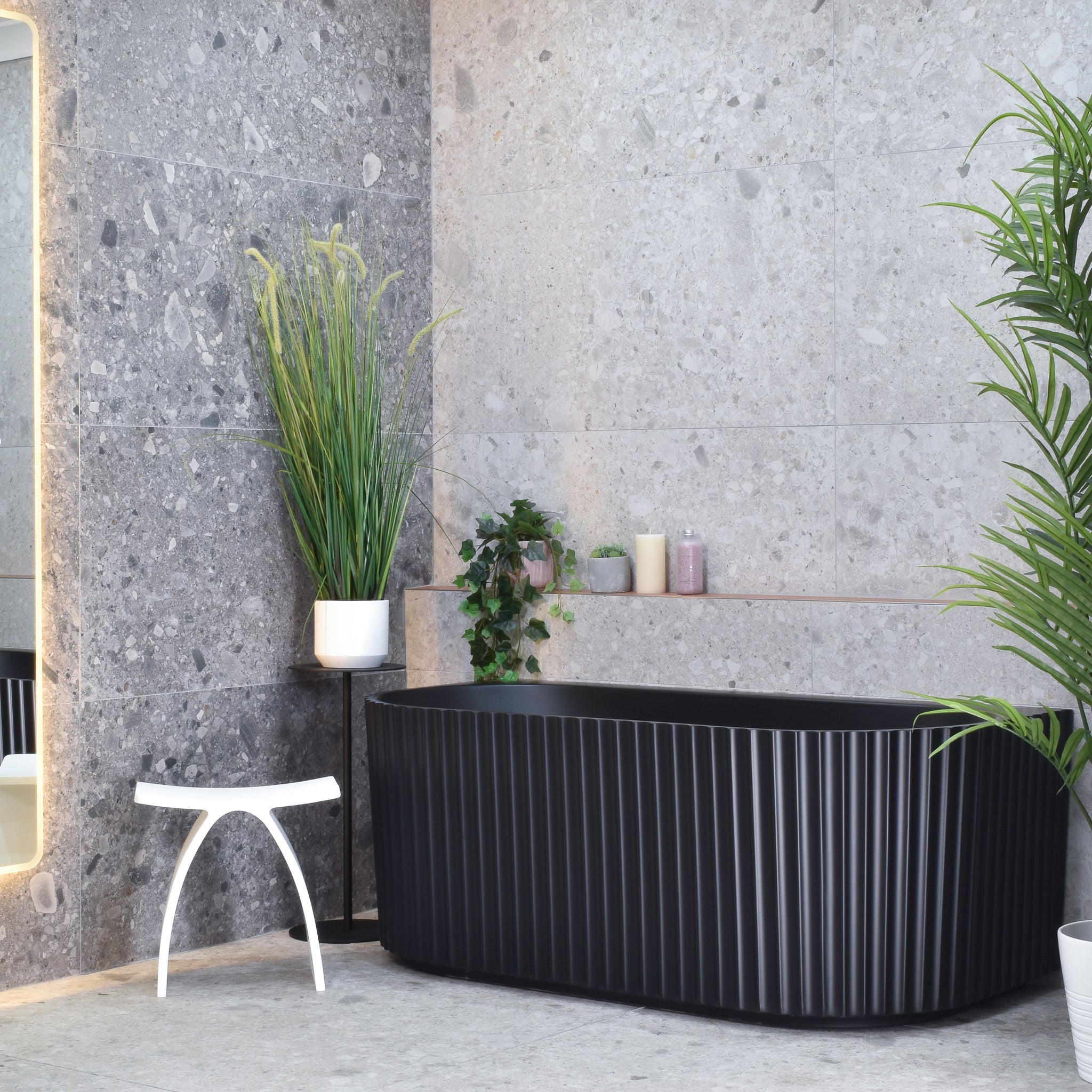 Agora Groove 1500mm freestanding bathtub in matte black, angled front view