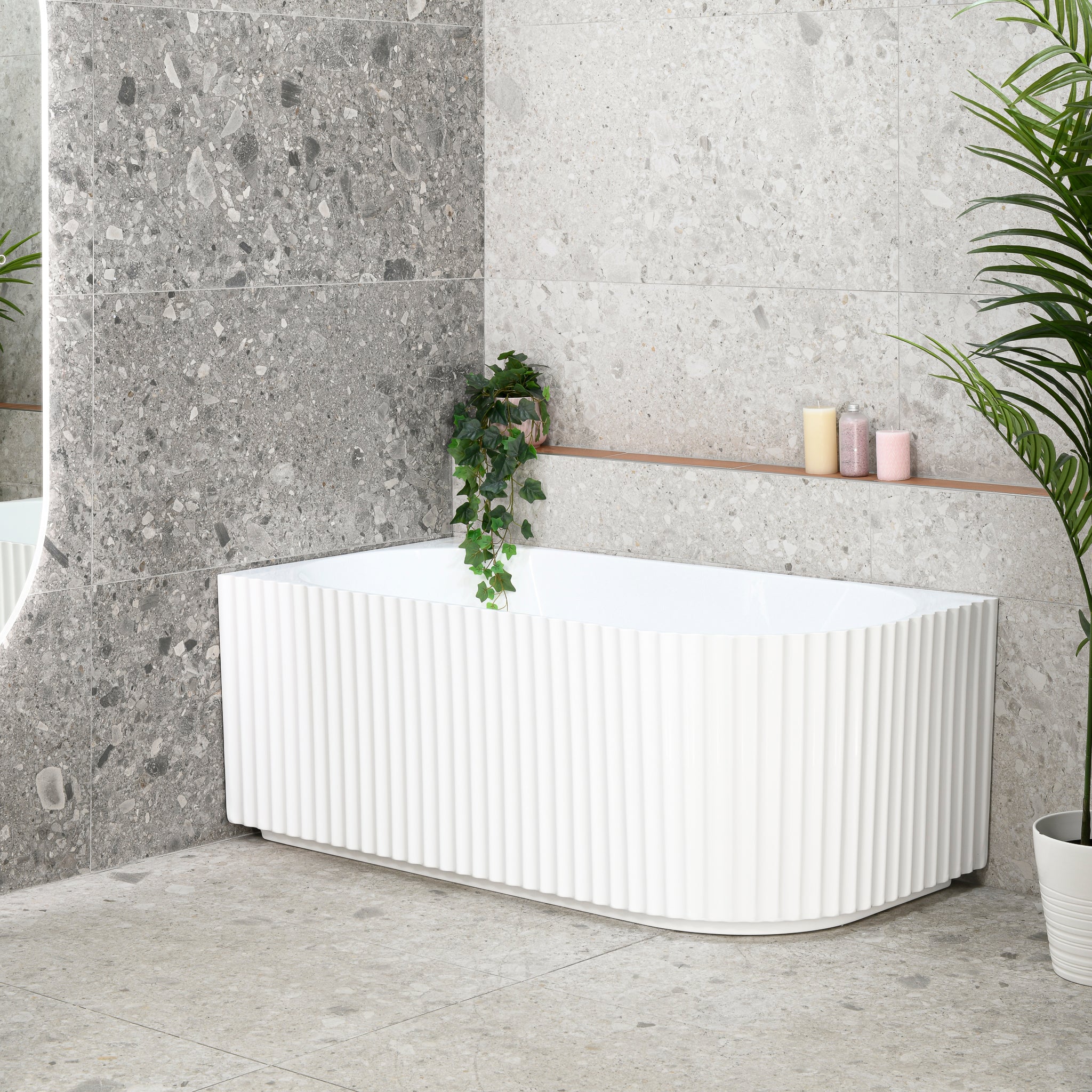 Agora Groove 1700mm left corner bathtub in gloss white, angled side view