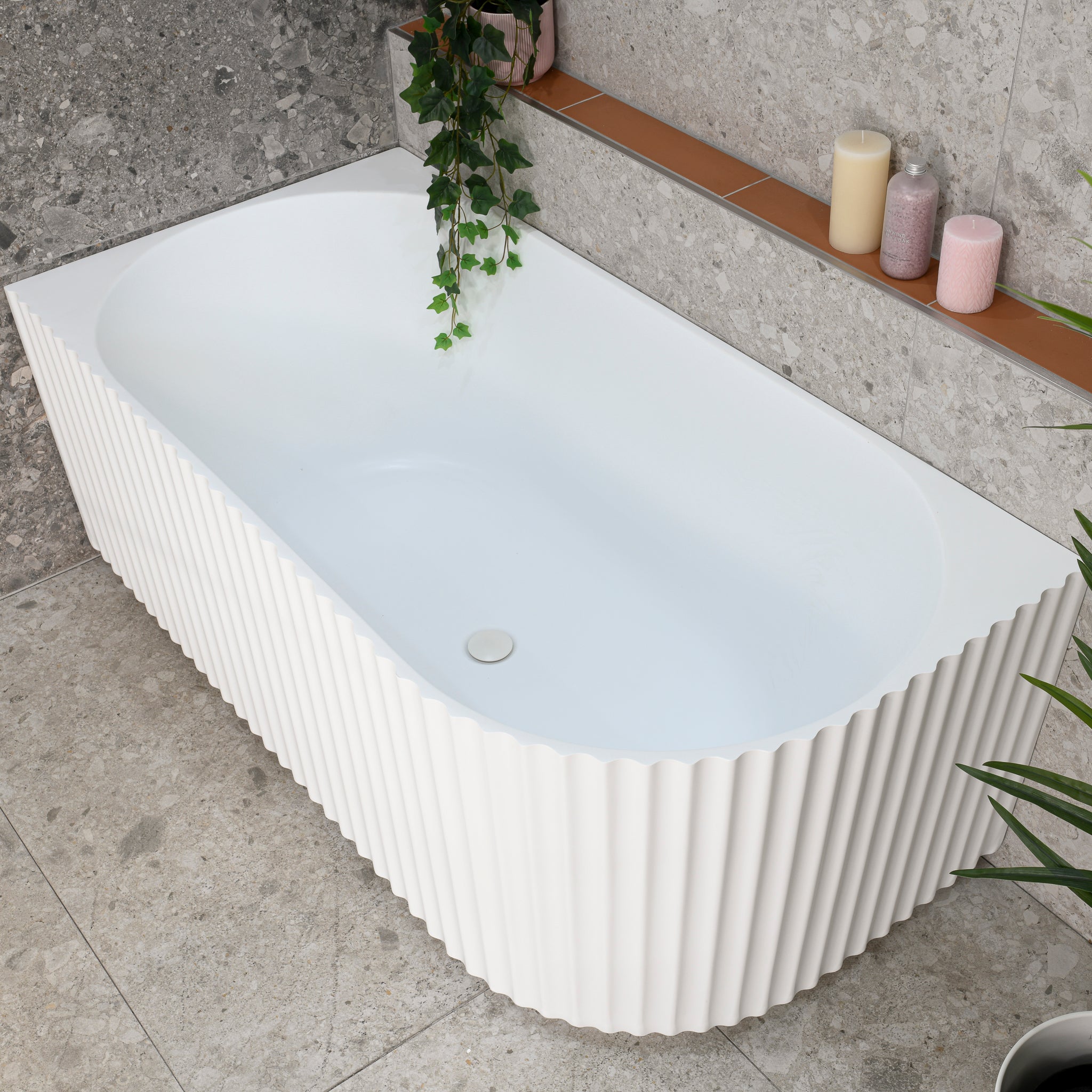 Agora Groove 1500mm left corner bathtub in matte white, angled top down view