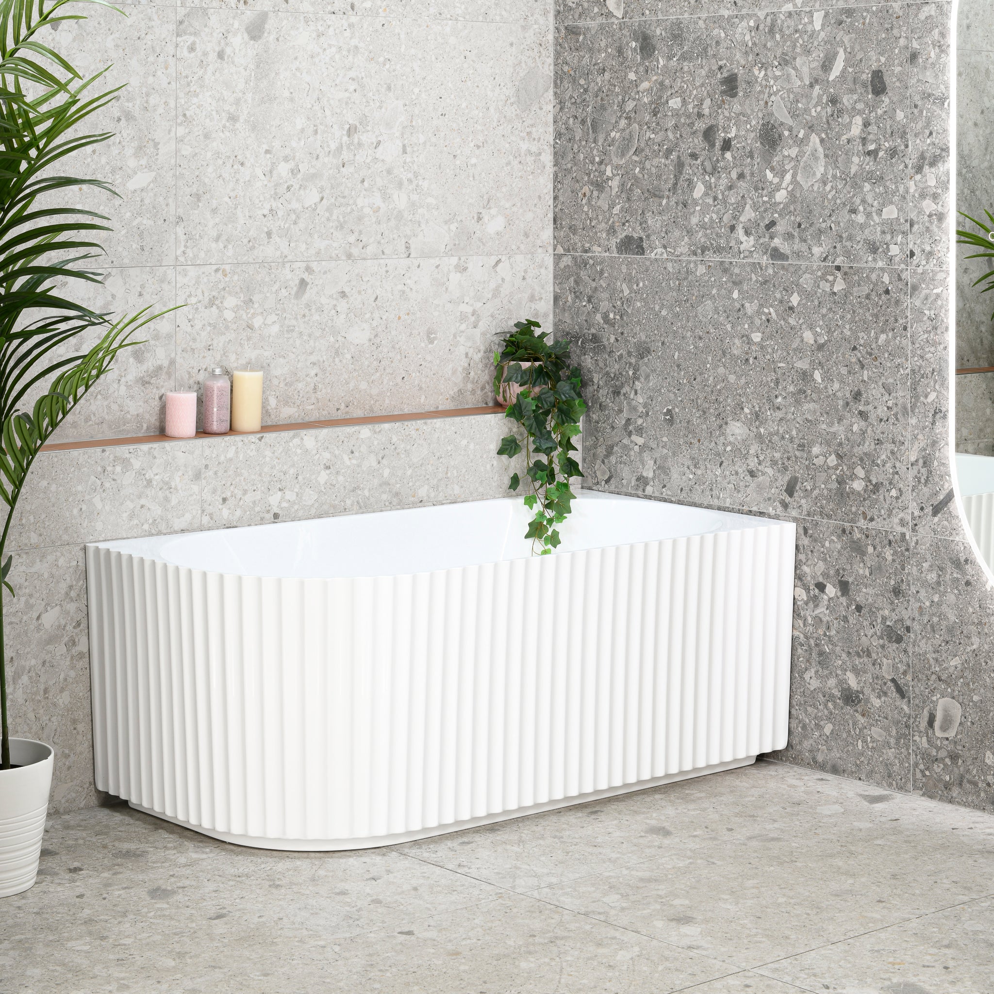 Agora Groove 1500mm right corner bathtub in gloss white, angled side view