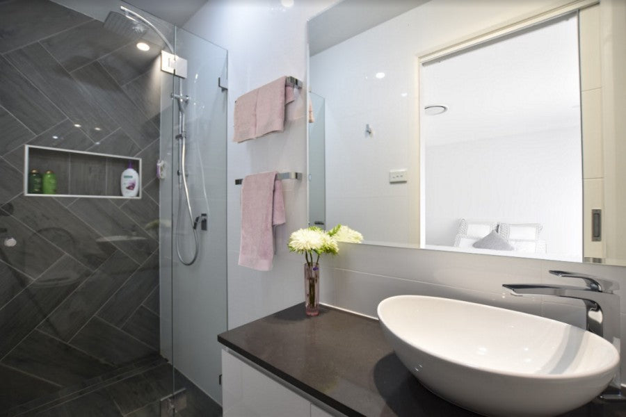 #46 - Bathrooms: Mario's ensuite room with a timber look tile laid in herringbone pattern