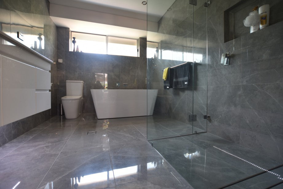 #53 - Bathrooms: Spanish grey marble tiles everywhere has class, by Fran