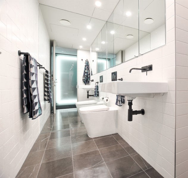 #55 - Bathrooms: Cooper's tiny ensuite with pietra marble floors and a full wall mirror