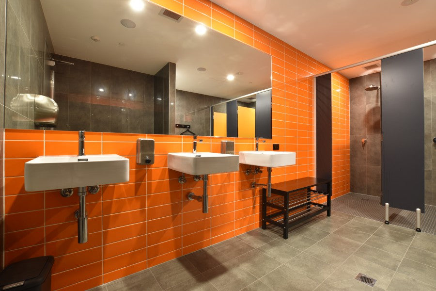 #66 - Bathrooms: Commercial bathroom with orange and black colour scheme