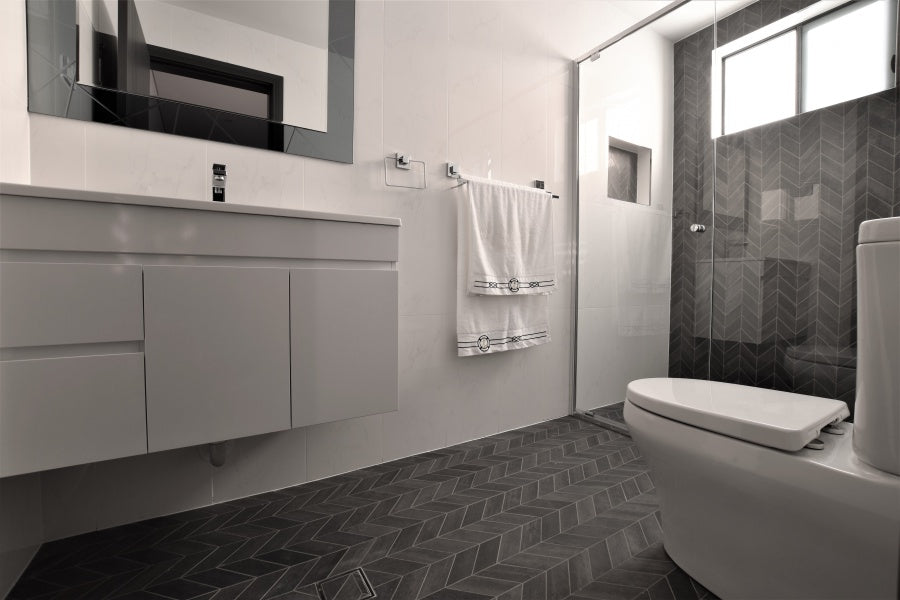 #85 - Bathrooms: Chevron (arrow) mosaics run throughout the floor and a feature wall