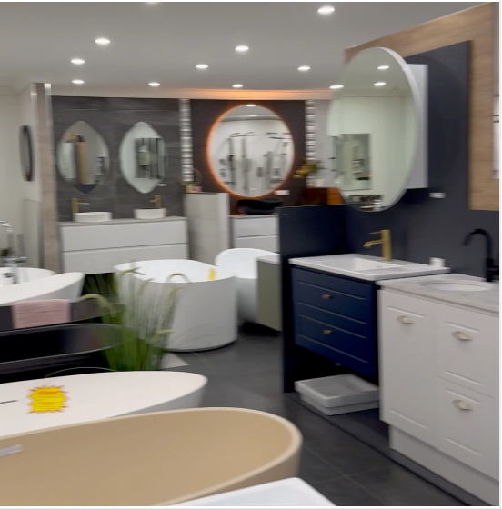 A well-organized bathroom displaying clearance items, including sinks, tubs, and mirrors, highlighting modern design elements.