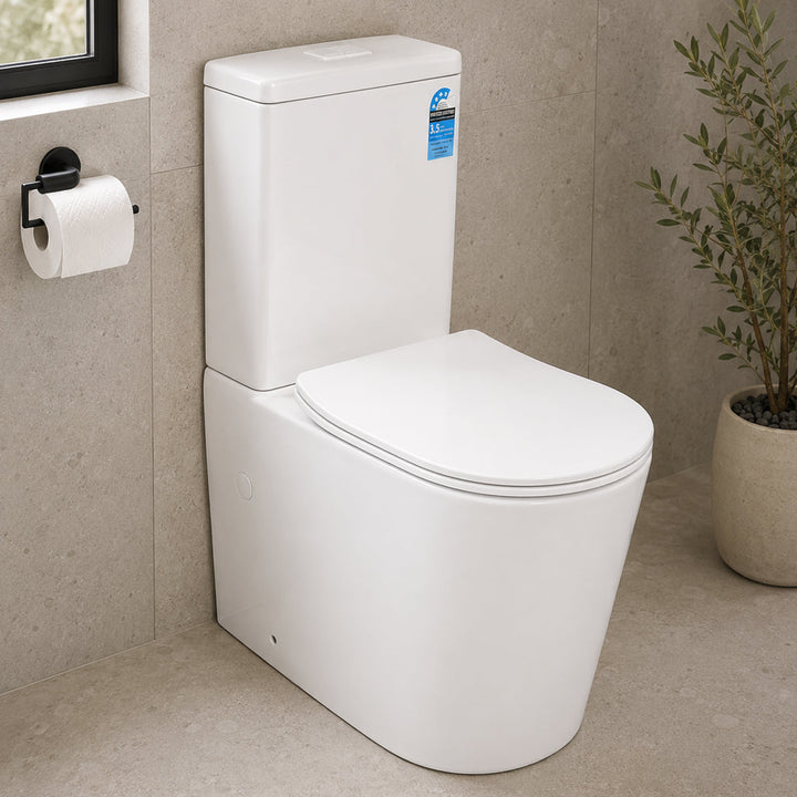 Matte white back to wall toilet suite in modern bathroom with stone-look tiles and minimalist styling