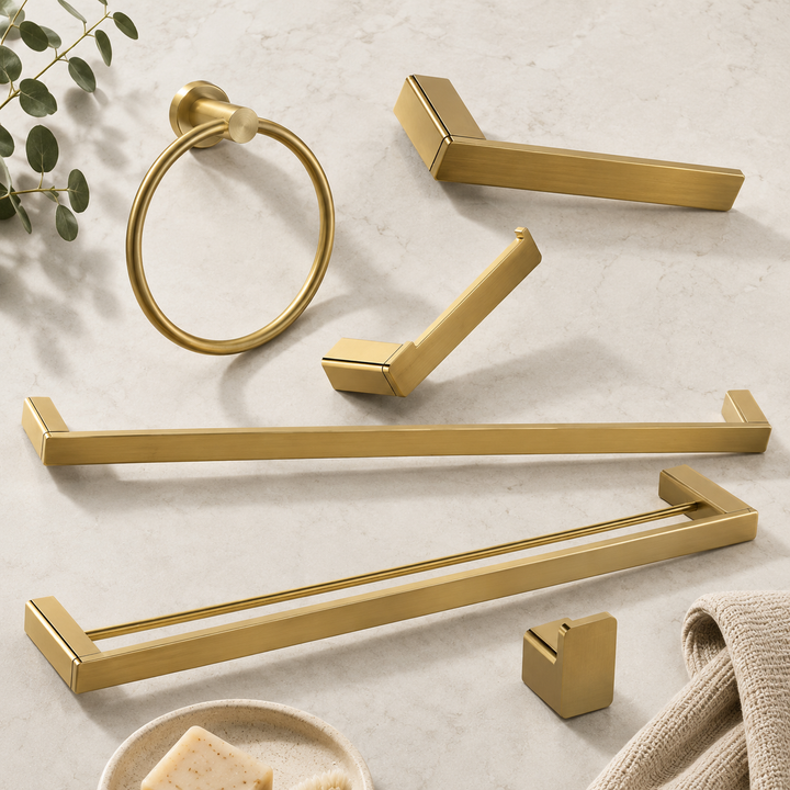 Brushed brass gold bathroom accessories including towel rails, towel ring, robe hook and toilet roll holder