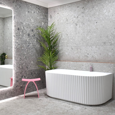 Agora Groove 1700mm back to wall bathtub in matte white, angled side view