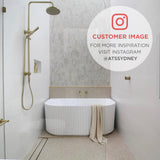 Customer bathroom featuring the Agora Groove 1500mm freestanding bathtub in gloss white