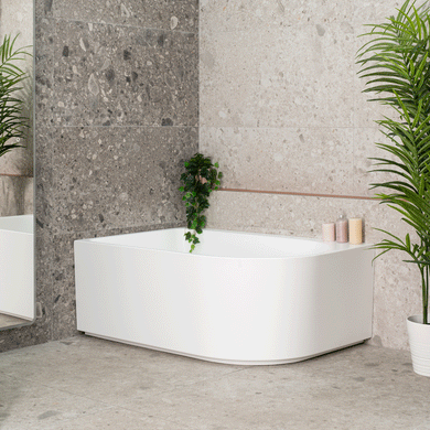 Arco Plus 1400mm left corner bathtub in matte white shown in angled side view GIF