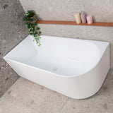 Arco 1600mm left corner bathtub in matte white, angled top down view