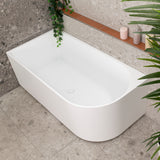 Arco 1500mm left corner bathtub in matte white, angled top down view