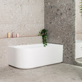 Arco 1500mm right corner bathtub in matte white, angled front view