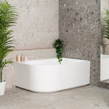 Arco Plus 1400mm right corner bathtub in matte white, angled side view