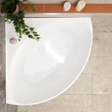 Angie Corner 1000mm bathtub in white colour shown with a model