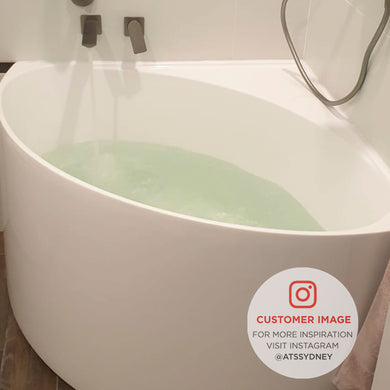 Customer bathroom featuring the Angie corner 800mm bathtub white