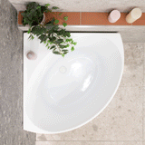 Angie Corner 800mm bathtub in white colour shown with a model
