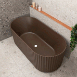 Agora Groove 1700mm off the wall bath in chocolate brown shown with two models of different heights