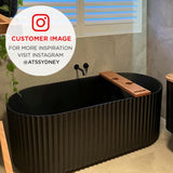Customer bathroom featuring the Agora Groove 1700mm off the wall bathtub in matte black