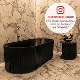 Customer bathroom featuring the Agora Groove 1700mm off the wall bathtub in matte black