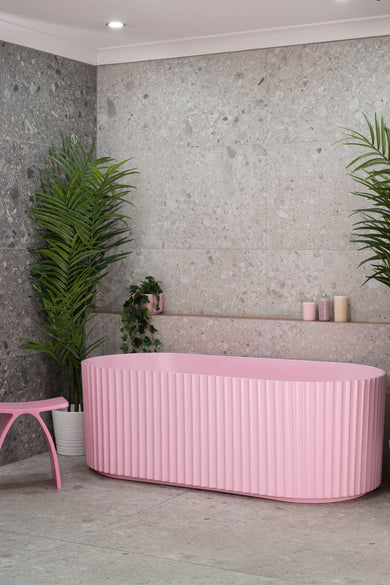 Agora Groove 1700mm off the wall bathtub in matte pink, angled front view