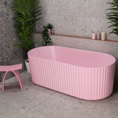 Agora Groove 1700mm off the wall bathtub in matte pink, angled top down view
