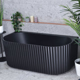 Agora Groove 1500mm back to wall bathtub in matte black, angled top down view