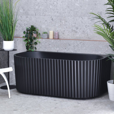 Agora Groove 1500mm back to wall bathtub in matte black, angled front view