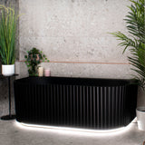 Agora Groove 1500mm back to wall bathtub with LED lights in matte black, angled front view