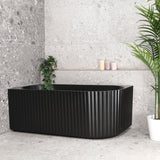 Agora Groove 1500mm left corner bathtub in matte black, angled front view