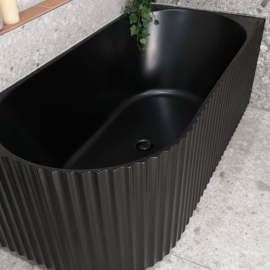 Agora Groove 1500mm right corner bathtub in matte black, top down view