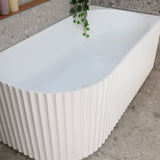 Agora Groove 1500mm right corner bathtub in matte white, zoomed top down view