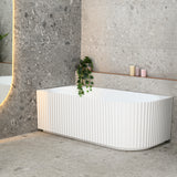 Agora Groove 1700mm left corner bathtub in gloss white, angled side view