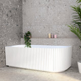 Agora Groove 1700mm left corner bathtub in matte white, angled front view
