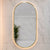 Pill Oval 500mm x 1000mm Backlit LED Framed Mirror with Demister, Brushed Brass (Gold) Frame