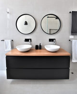 2 Deluxe 600mm Round Mirrors with Black Frame on a Limestone White Tile. Timber Bench tops on Black All-Drawer Vanities
