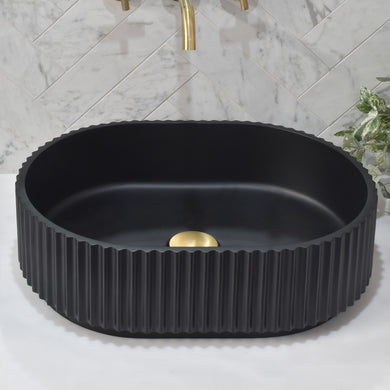 Fluted-oval-basin-black-showing-drain