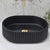    Fluted-oval-basin-black-showing-drain
